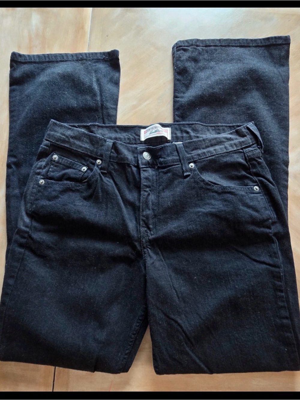Women’s bootcut black Levi long jeans